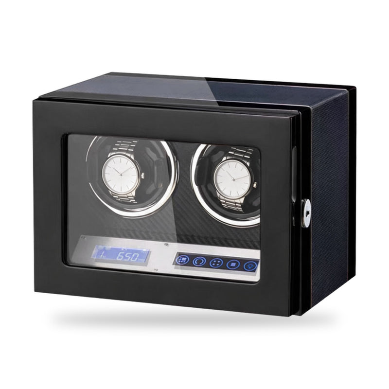 Belgrave two-watch winder, gloss black cabinet with a carbon-effect panel inside, touchscreen and turns-per-day display on the front, on a plain white background, plain unbranded watches on the cushions.