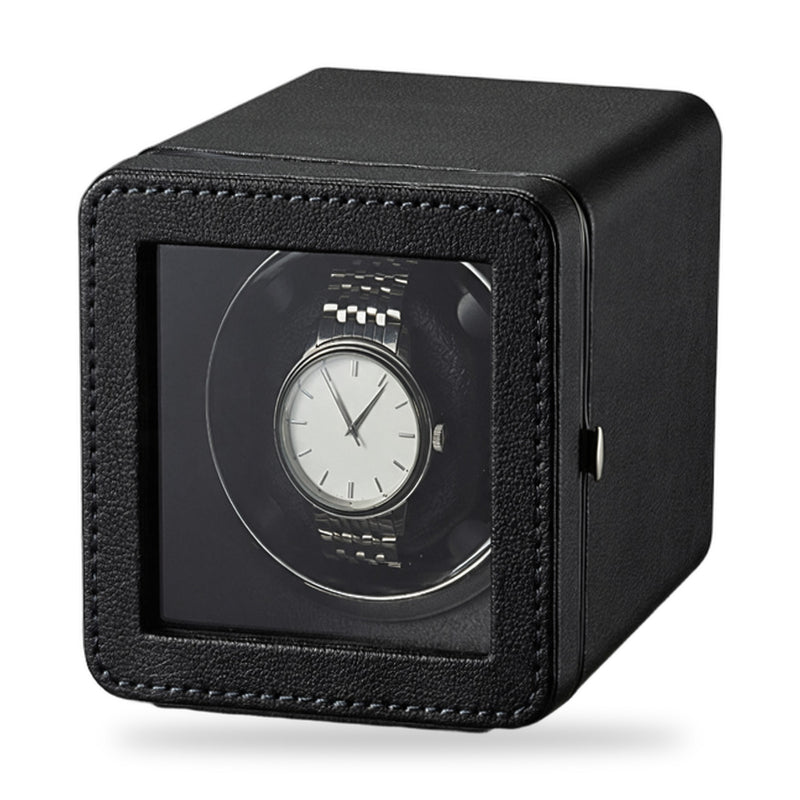 Hadley single watch winder, black case in stitched PU leather, glass door, on a plain white background, a plain unbranded watch on the cushion.